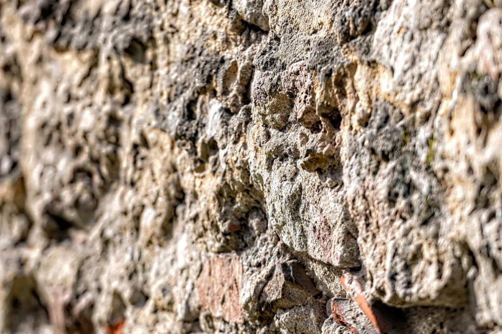 decorative exterior wall plaster with embossed surface, selective focus