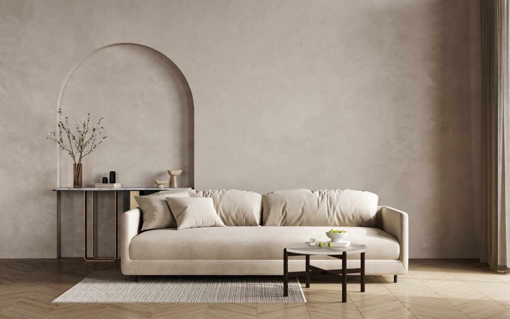 Stylish living room in warm natural colors. Brown beige walls, light lounge furniture